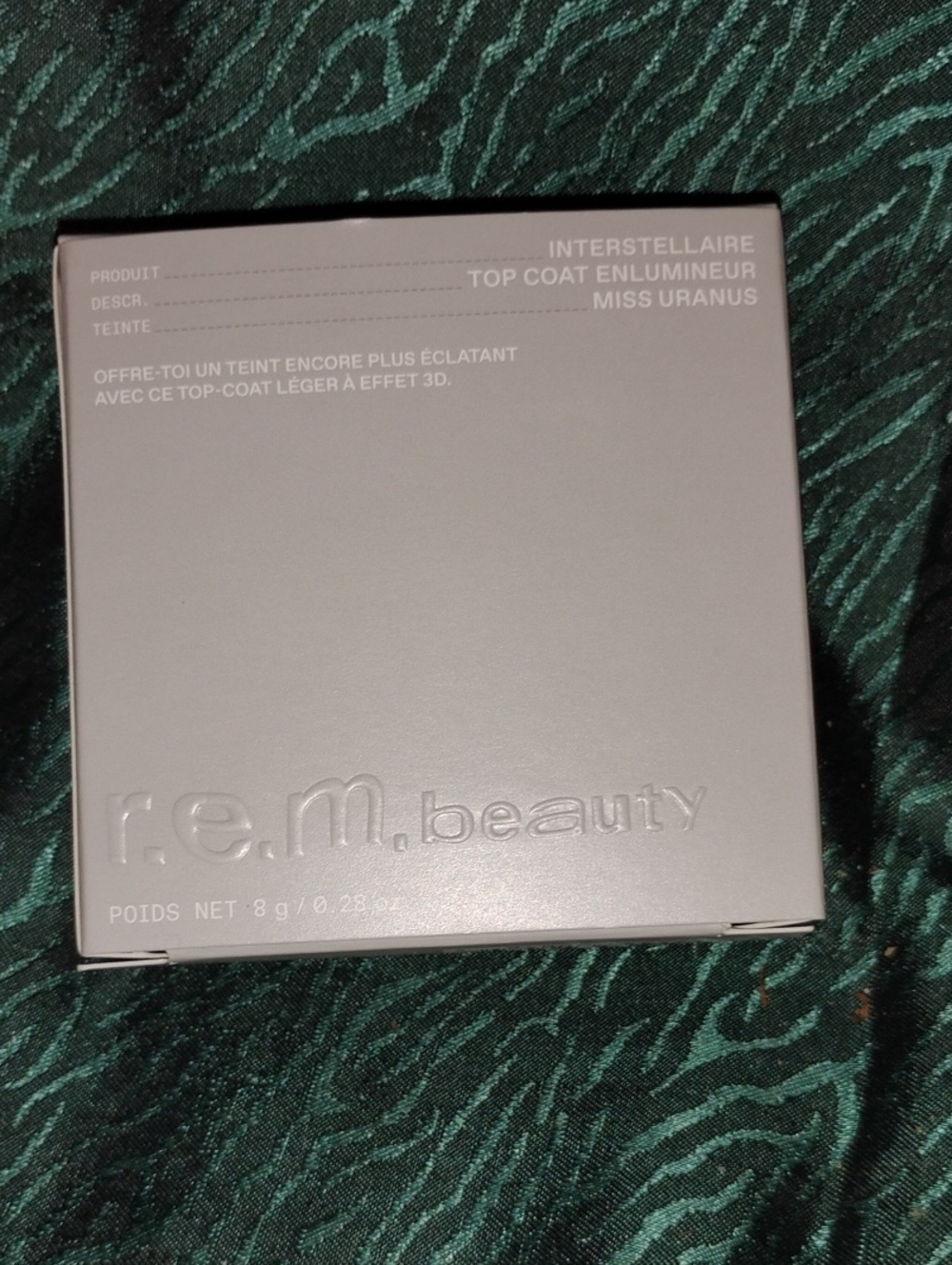 r.e.m. beauty Interstellaire Highlighter Top Coat - Miss Uranus (Silver)